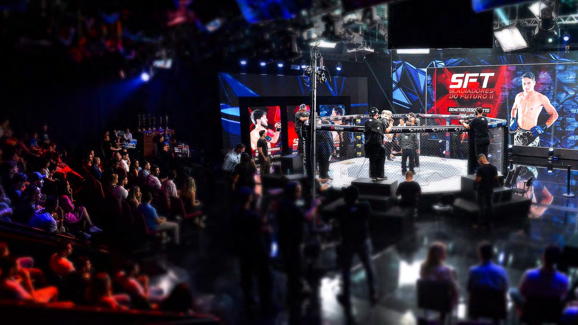 SFT Combat arena during an event, with the octagon lit, crowd and broadcast rig